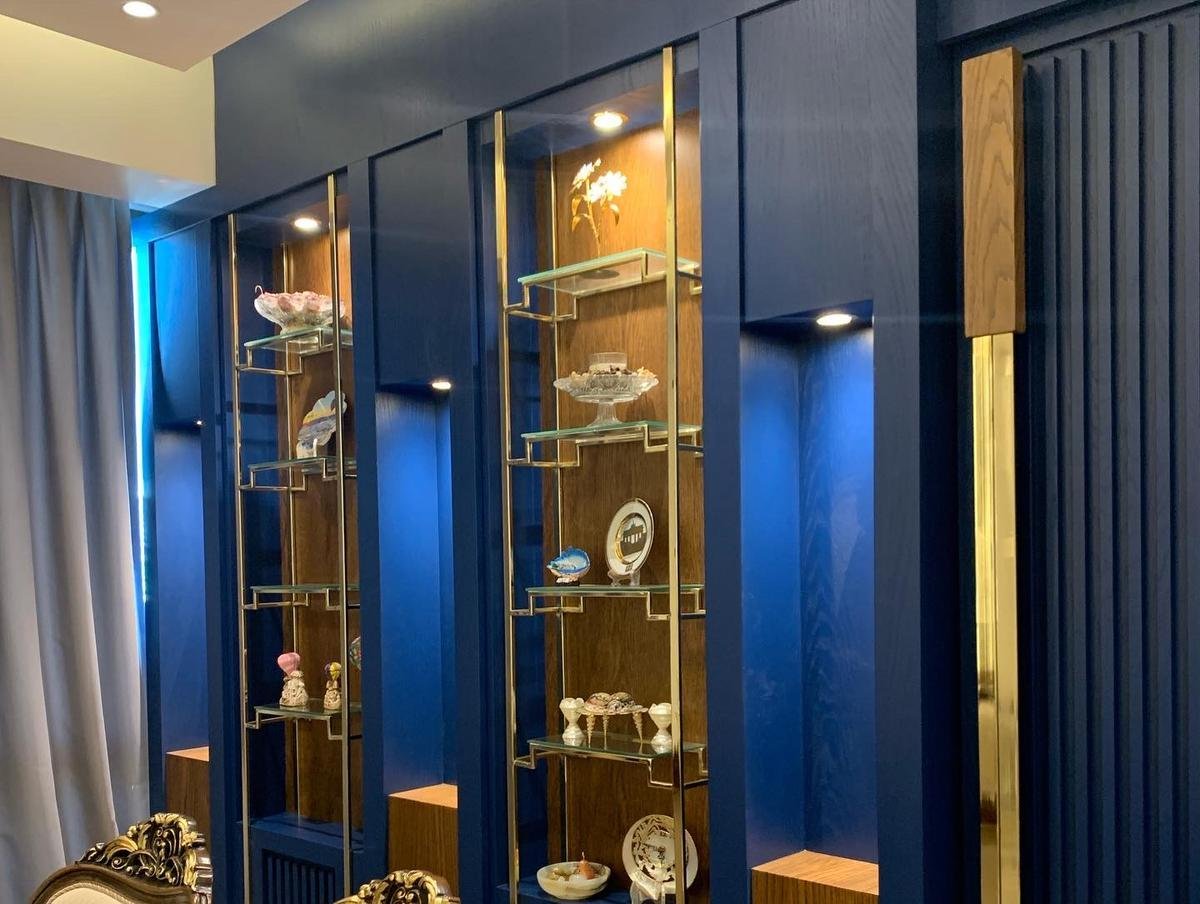 Custom display cabinet with glass shelves and accent lighting